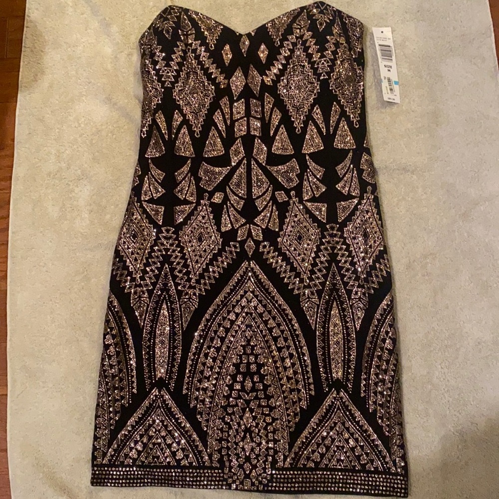 Size medium black & gold cocktail dress. New with tags!